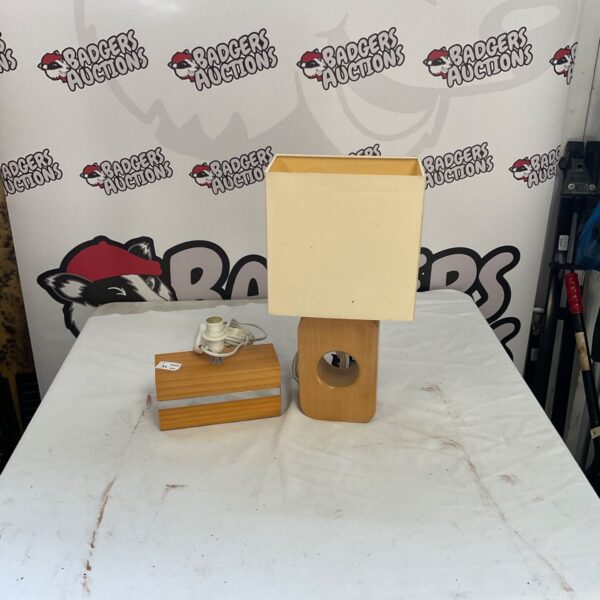 Vintage table lamp pair with cream shade and wooden base.