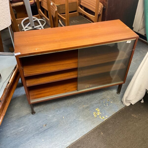 Vintage teak bookcase with sliding glass doors, mid-century modern style.