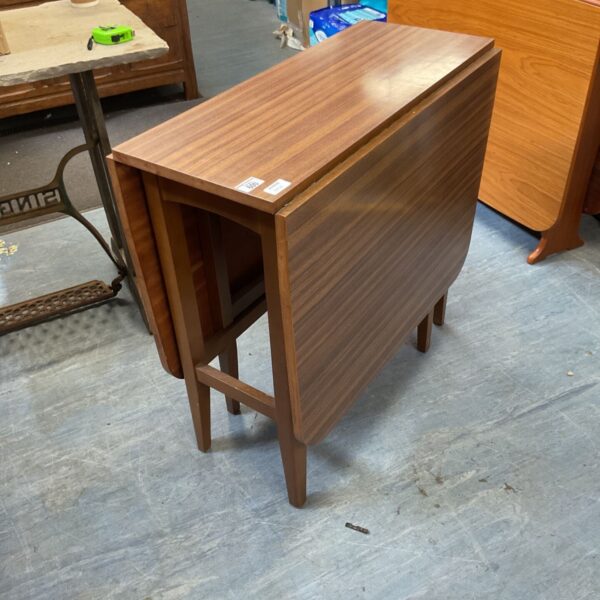 Vintage 1960s teak drop leaf dining table in good condition.