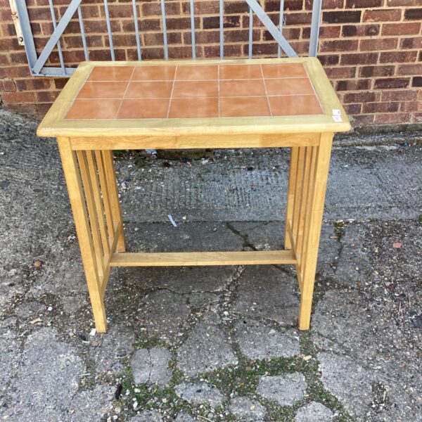 Vintage terracotta tile table with hardwood frame.