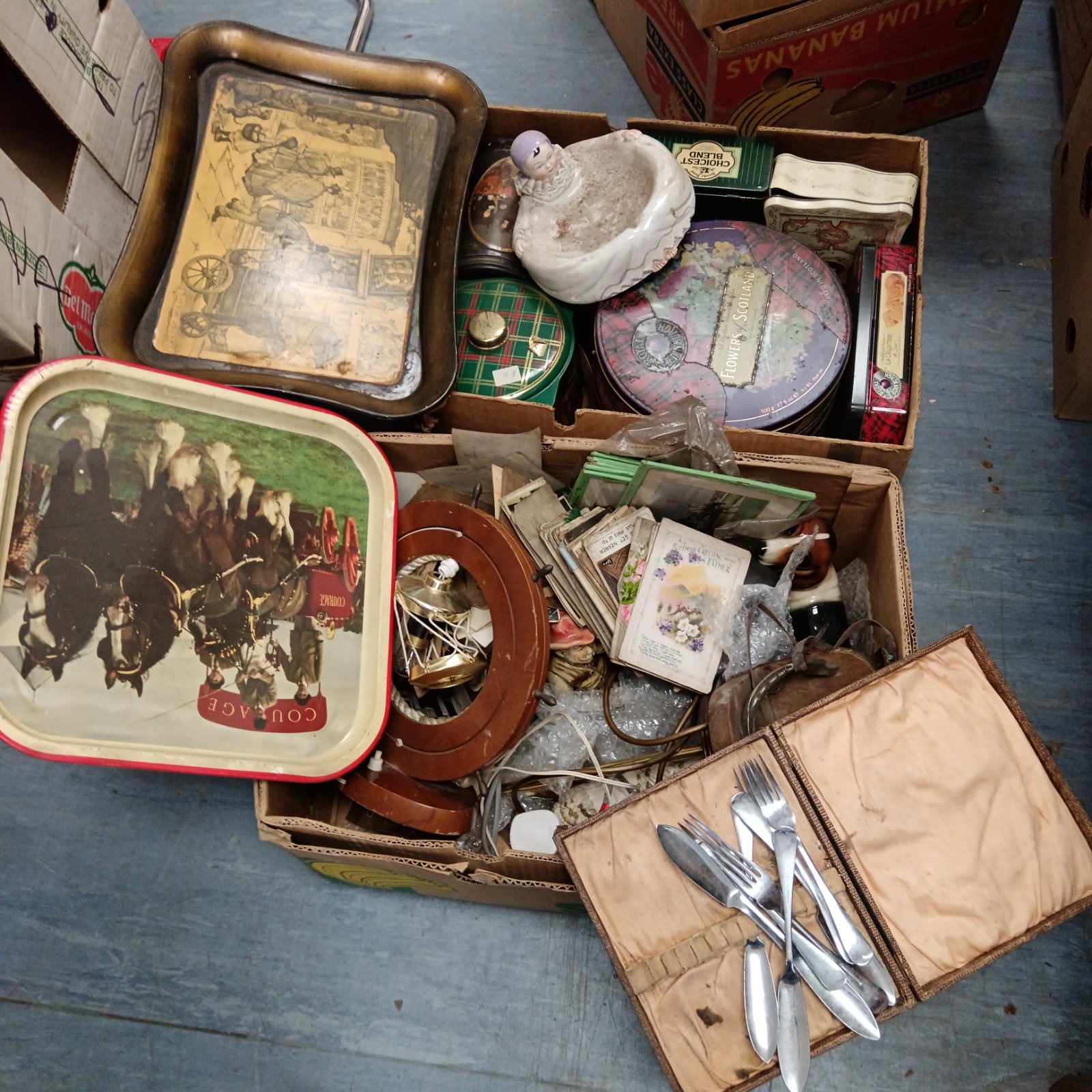 Vintage tin collection with colourful advertising designs.