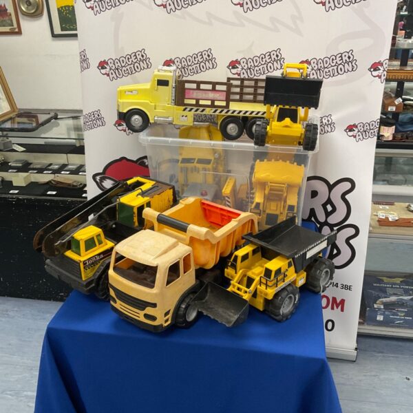 Yellow vintage Tonka toy truck, collectible metal toy.