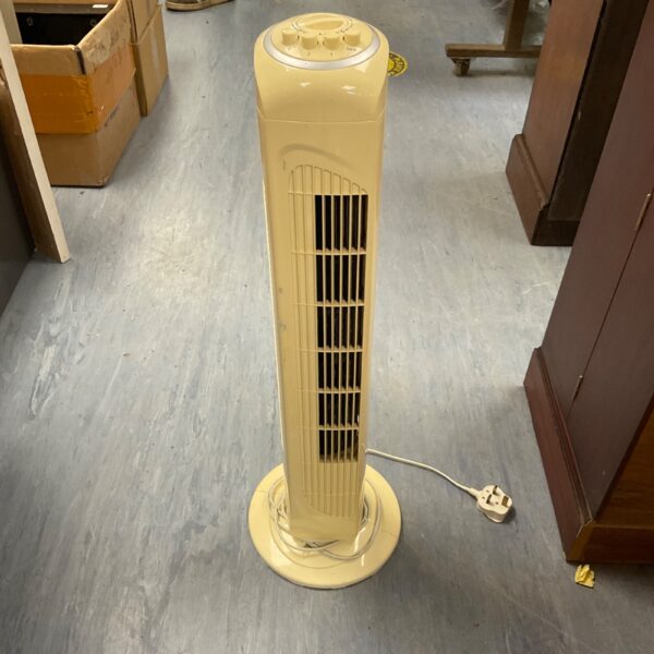 Yellow vintage tower fan, retro electric cooling appliance.