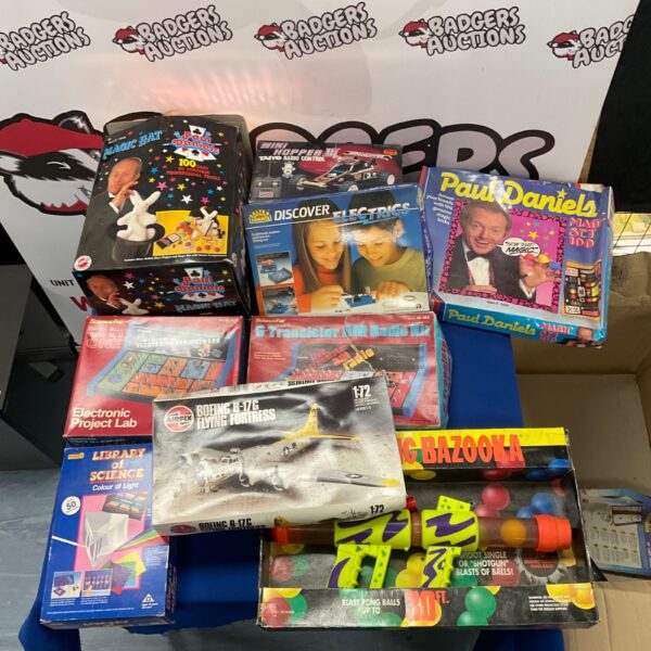 Overview of a vintage toy lot with magic sets and kits.