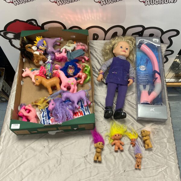Vintage toy lot featuring colourful Troll dolls and a My Little Pony.