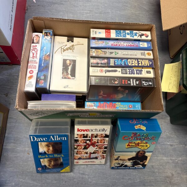 Vintage VHS tape lot with various movie titles.