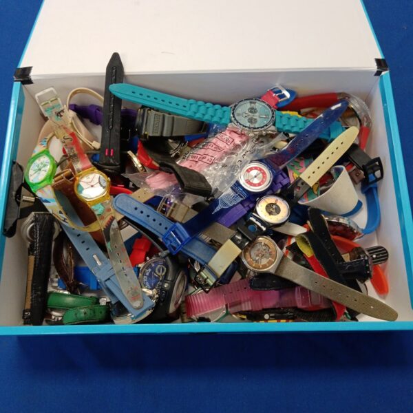 Vintage watch collection lot including Swatch and Liberty timepieces.