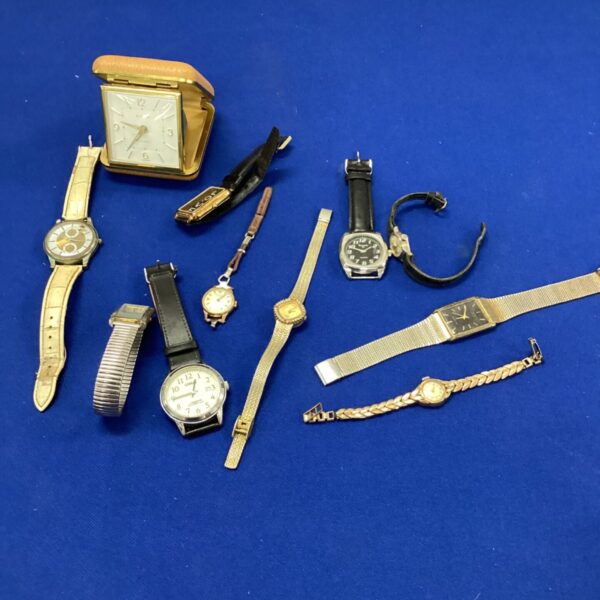 Vintage watch lot with travel clock, analogue timepieces.