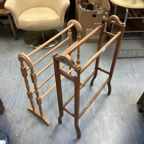 Vintage wooden clothes horse for drying laundry, showing wear.