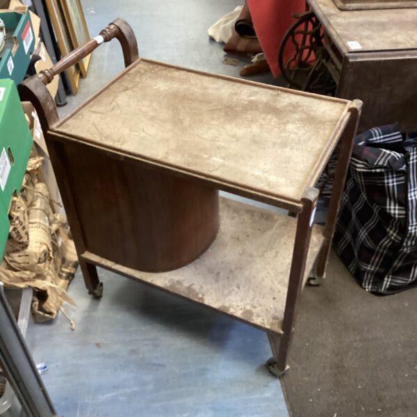 Vintage wooden trolley with caster wheels, awaiting restoration.