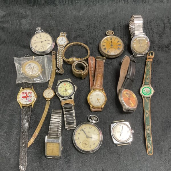Vintage wristwatch collection, assorted antique timepieces on display.