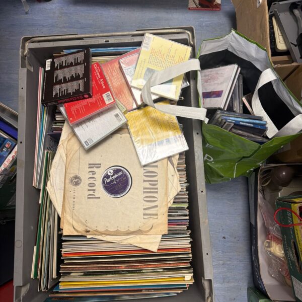 Large lot of mixed vinyl records and CDs for music collectors.