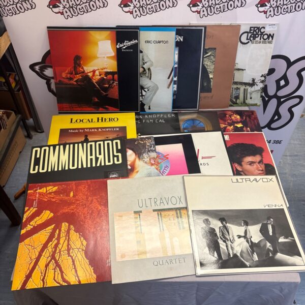 Bundle of vintage vinyl records including Eric Clapton and Wham.