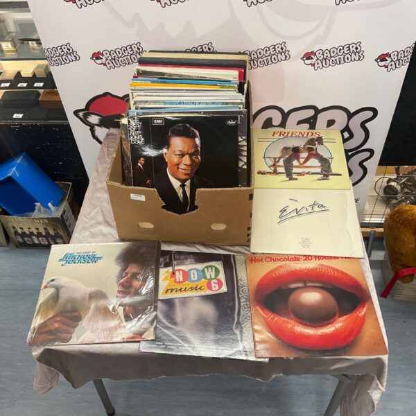 Assorted vinyl records including Michael Jackson and Nat King Cole.