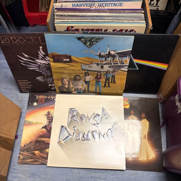 Vintage vinyl record collection including Pink Floyd, rock music.
