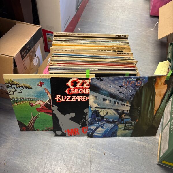 Mixed lot of twelve-inch vinyl records for collectors.