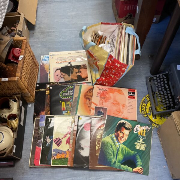 Vintage vinyl record collection lot with colourful covers.