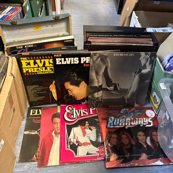 Vintage vinyl records lot featuring Elvis Presley and The Runaways.