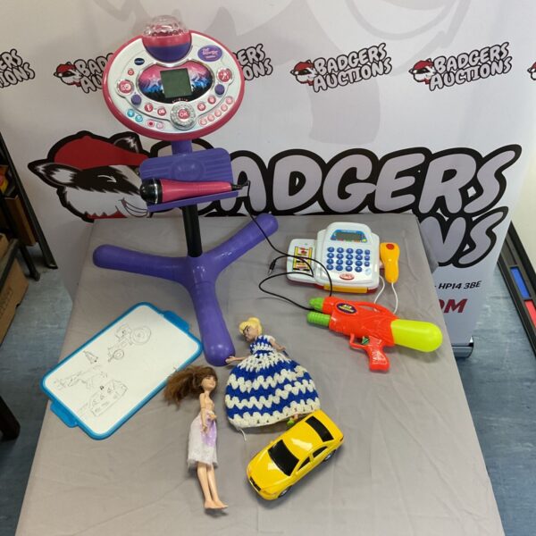 VTech Kidi Superstar lightshow amongst a box of children’s toys.