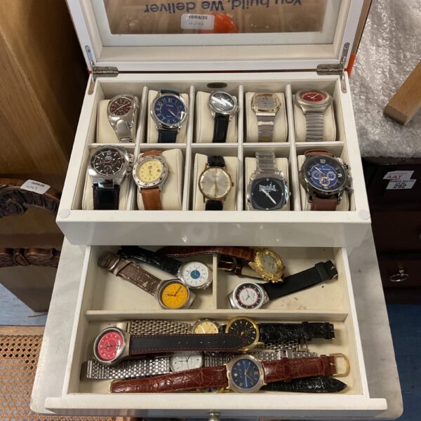 Diverse watch collection including Seiko and Nautica timepieces.