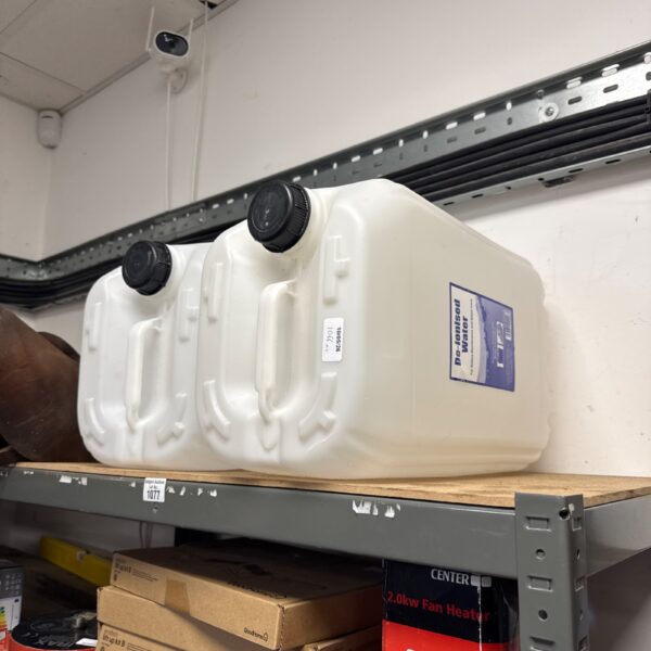 Empty 25l plastic water barrels for storage and DIY projects.
