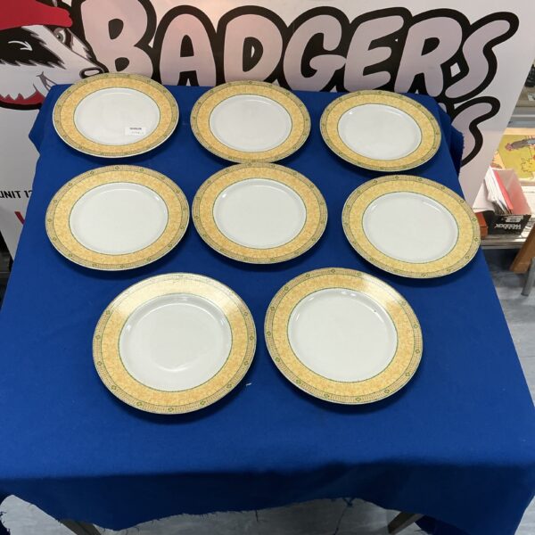 Eight Wedgwood Florence plates with floral design.