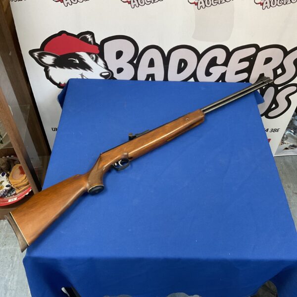 Vintage Weihrauch .22 cal air rifle with wooden stock.