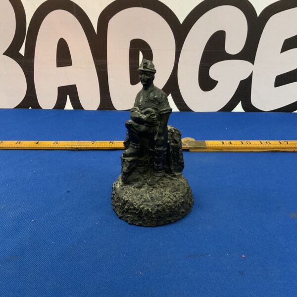 Detailed Welsh coal miner carving, a folk art collectible.