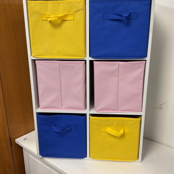 White 6-cube storage unit with colorful fabric storage boxes.
