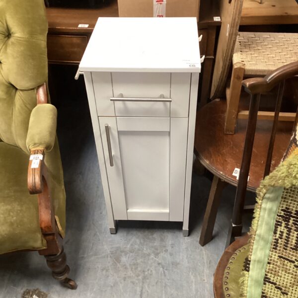 White bathroom cabinet with a single door, ideal for bathroom storage.