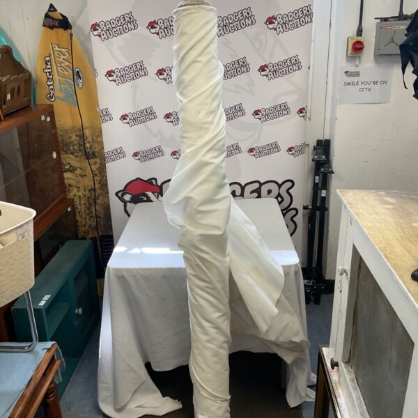 Large roll of white fabric for crafting and upholstery projects.