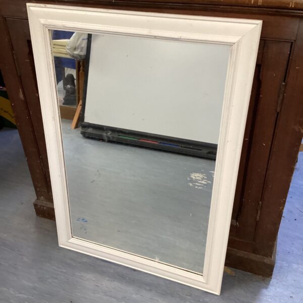 White framed mirror for wall decoration, vintage style.