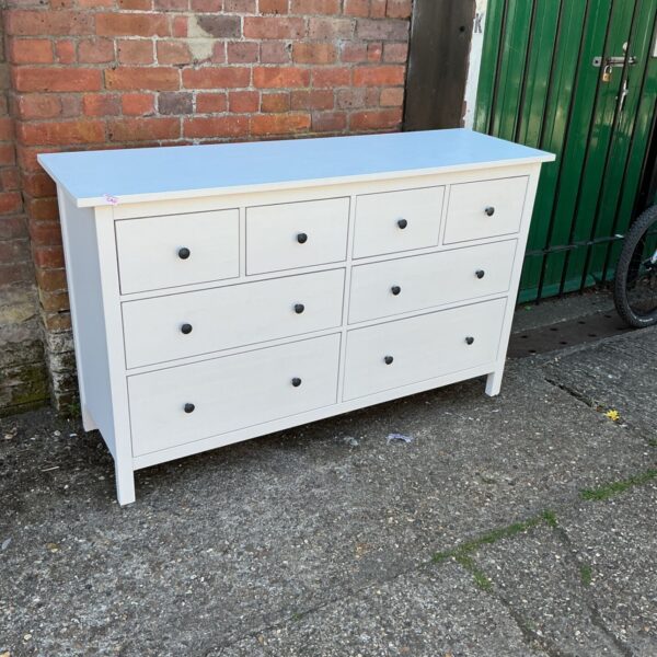 White IKEA eight drawer unit for bedroom storage.