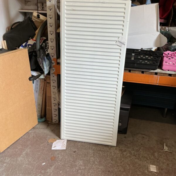 White double panel radiator, approximately 5ft long, for central heating.