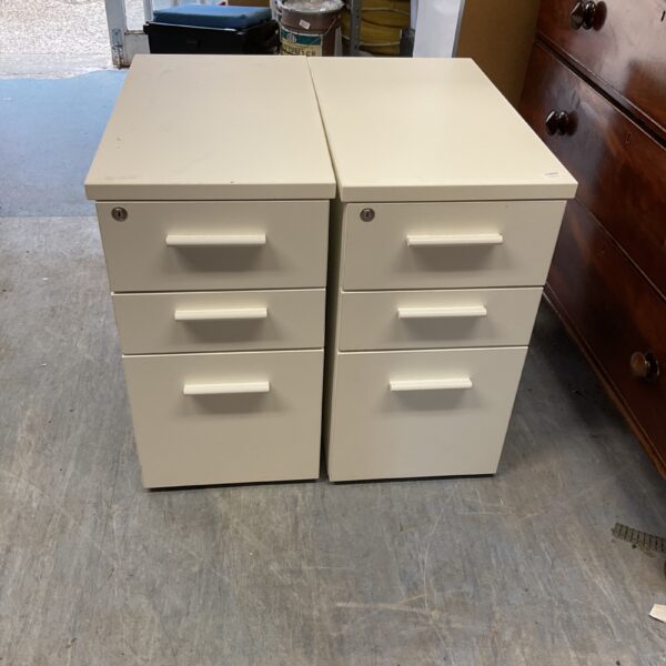 Two white wheel cabinets for office storage.