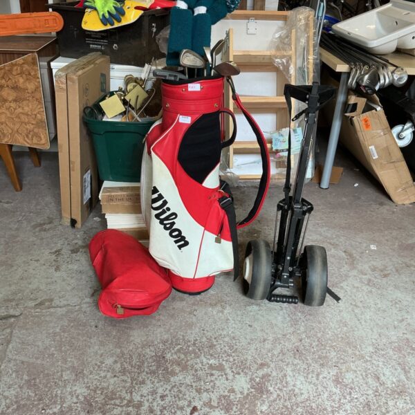 Vintage Wilson golf bag with clubs and trolley for sale.