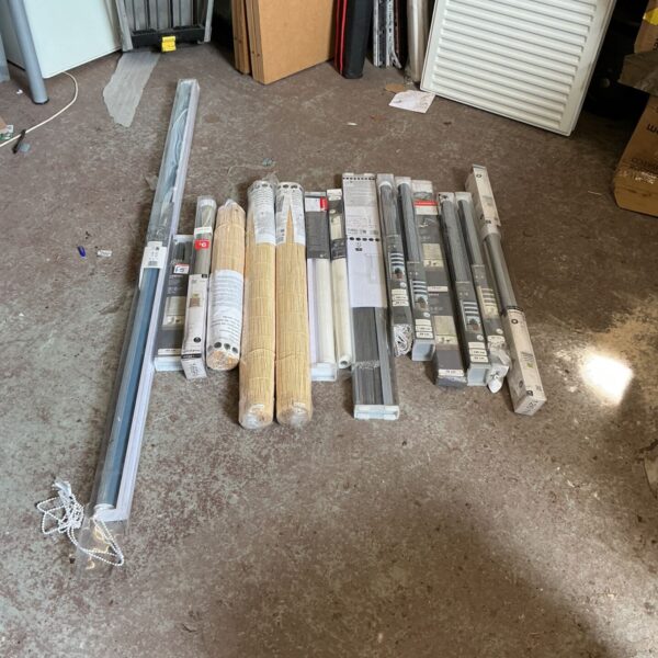 Assorted window blinds in various styles and sizes for home decor.