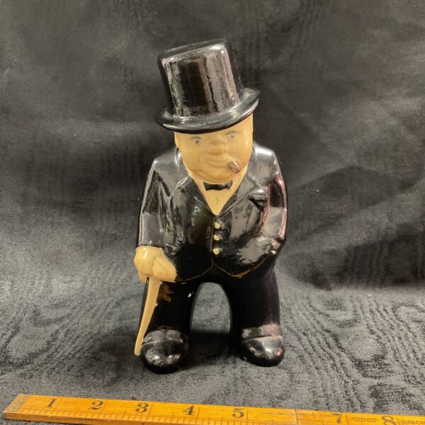 Vintage ceramic Winston Churchill figure with cigar and bow tie.