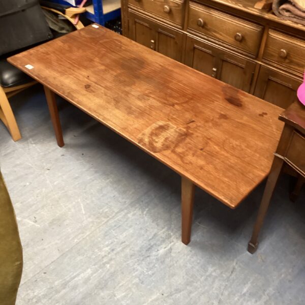Vintage wooden coffee table with mid-century modern style.