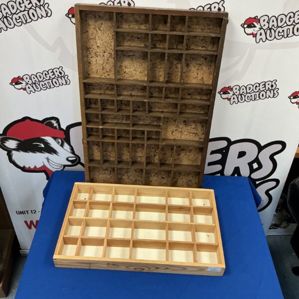 Vintage wooden display case with multiple compartments for collectibles.