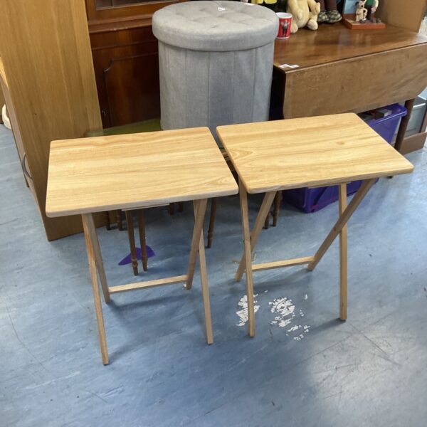 Pair of wooden folding side tables in original packaging.