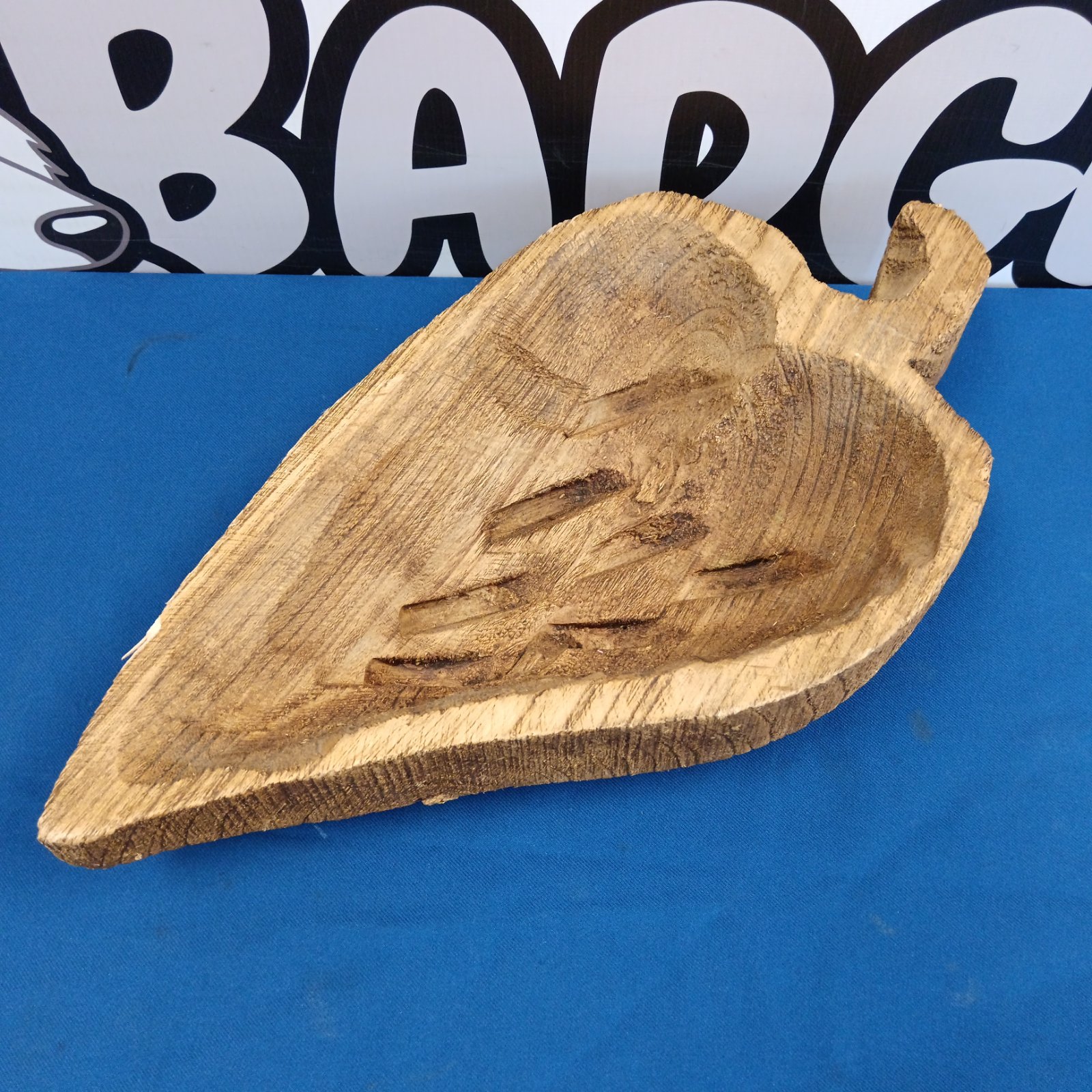 Rustic carved wooden strawberry bowl for serving fruit.