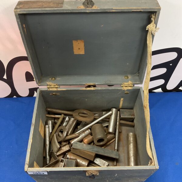 Vintage WWII Air Ministry amplifier box with metal washers inside.