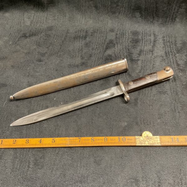 Vintage WW2 dress bayonet with composite grip.