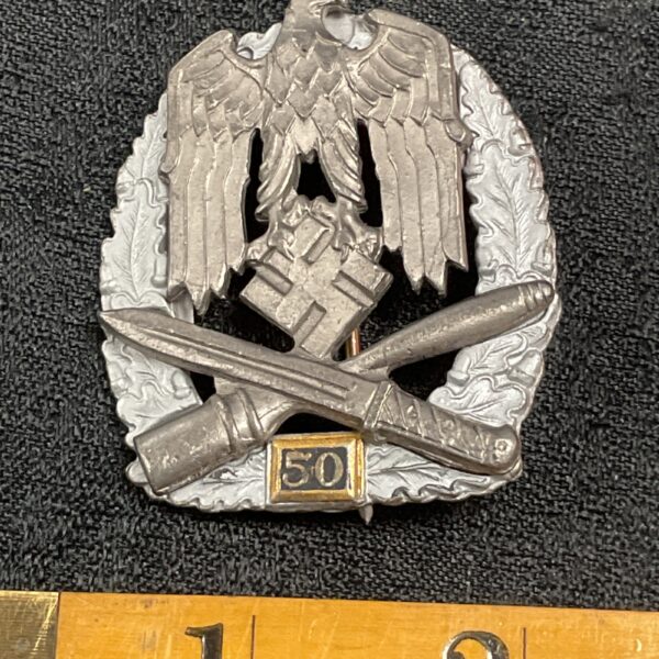 Front view of a WW2 German 50 year service reproduction badge.