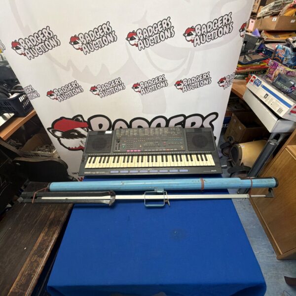 Yamaha PSR-640 keyboard with stand, electronic musical instrument.