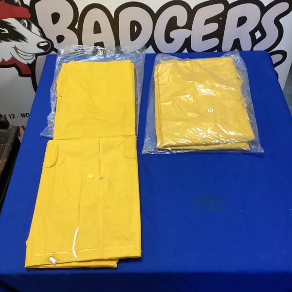 Bright yellow XL waterproof trousers and jacket set for outdoor use.