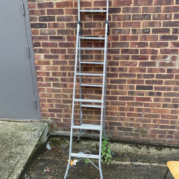 Aluminium combination ladder by Young Man, showing signs of use.