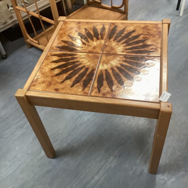 Vintage 1930s sunburst tile side table with art deco design.