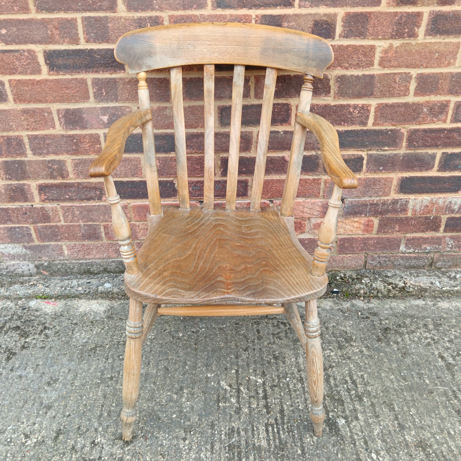 19th-century stripped ash Windsor armchair with spindle back.
